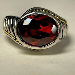 Garnet/dark orange colored rhinestone ring, silver and gold tone band Size 6.5
